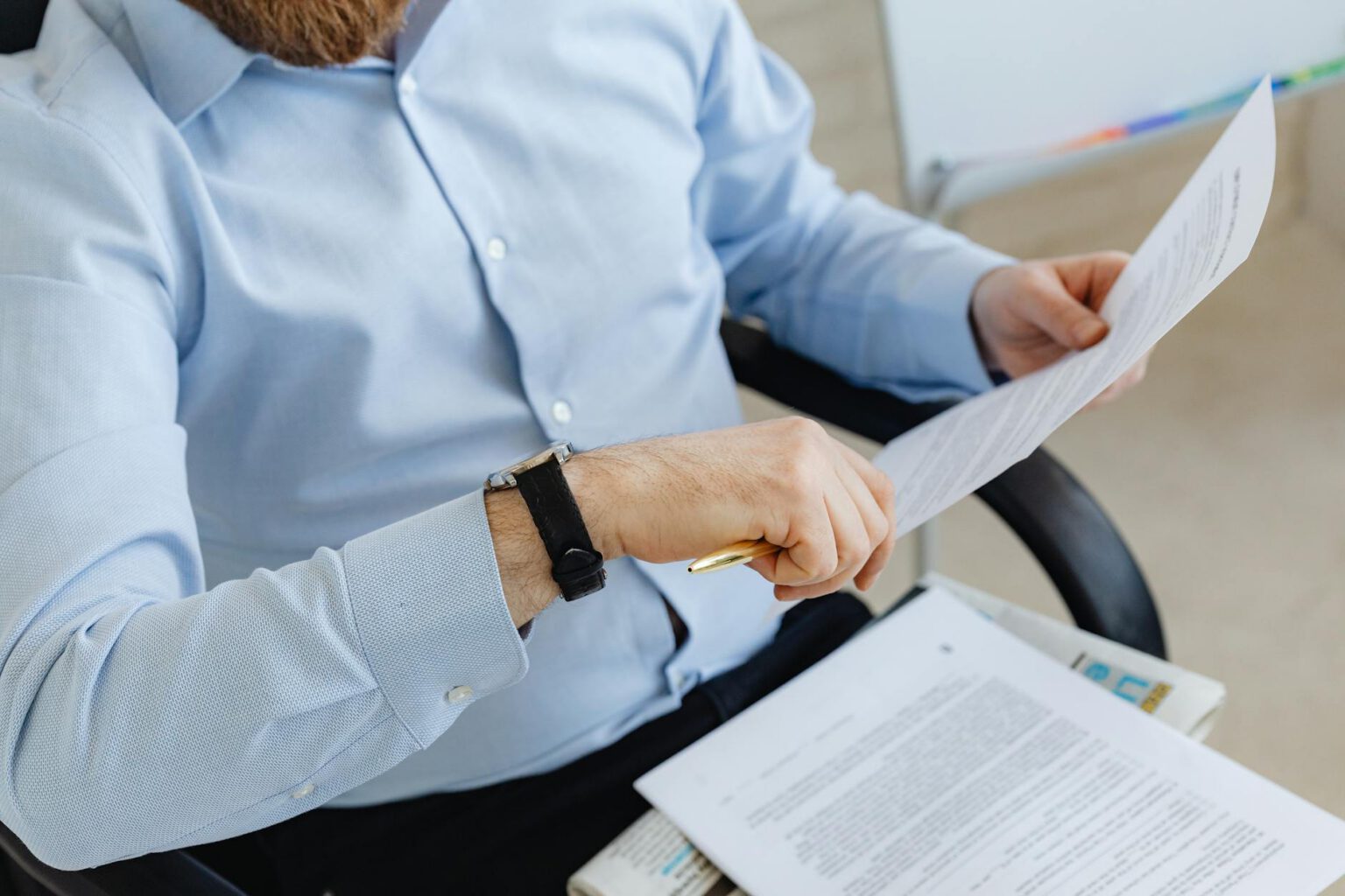 Professional reviewing procurement documents in an office setting