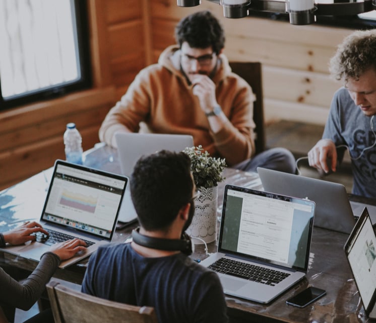 Diverse team collaborating in a bright, open workspace